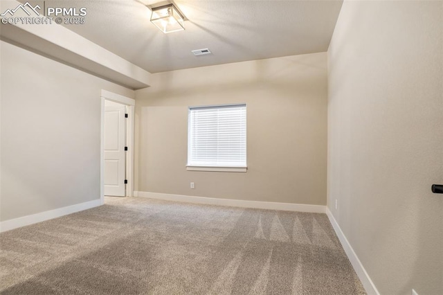 view of carpeted spare room