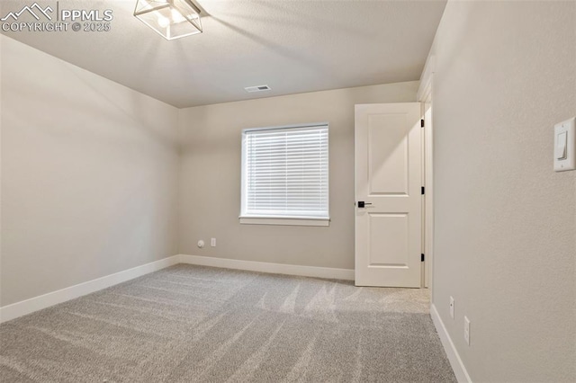 view of carpeted spare room