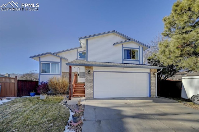 view of front facade with a front yard and a garage