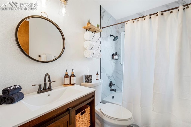 full bathroom featuring vanity, shower / tub combo, and toilet