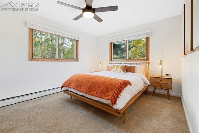 bedroom with baseboard heating, ceiling fan, and carpet floors