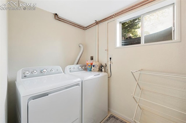 washroom with separate washer and dryer