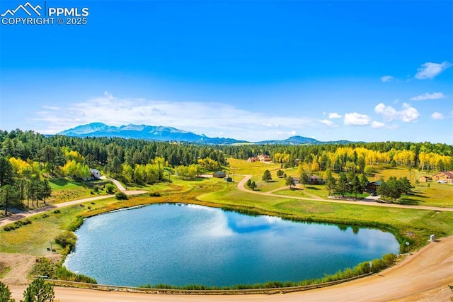 exterior space with a water and mountain view