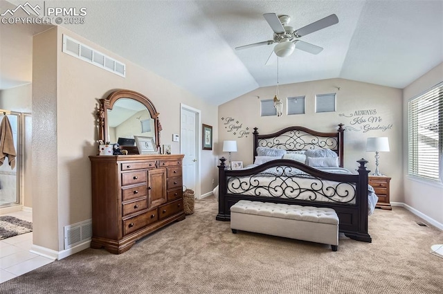 carpeted bedroom featuring ceiling fan and vaulted ceiling