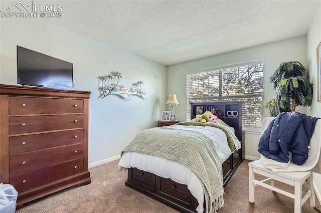 bedroom featuring a textured ceiling and carpet floors