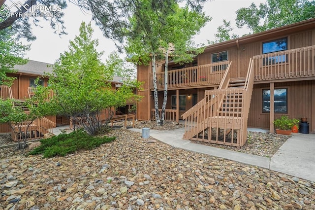 exterior space featuring a wooden deck