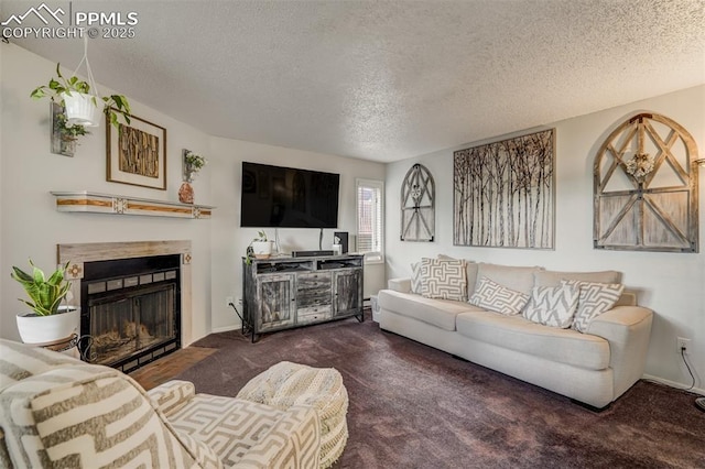 living room featuring dark colored carpet and a textured ceiling