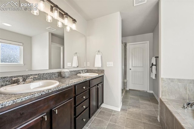 bathroom with separate shower and tub, tile patterned flooring, and vanity