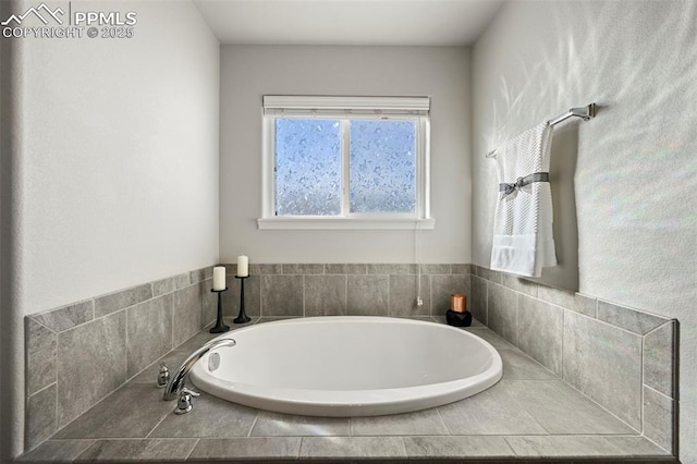 bathroom with a tub to relax in