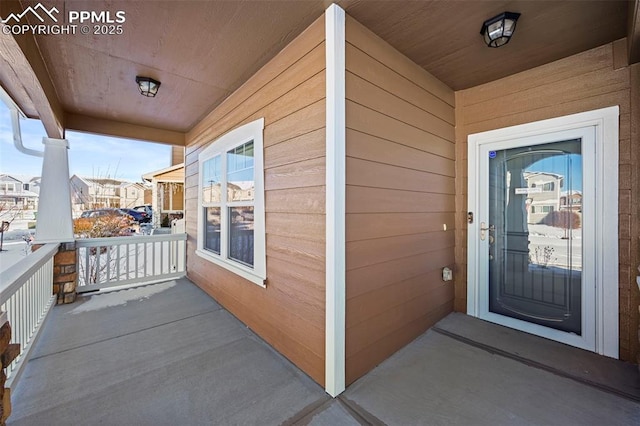 property entrance with covered porch