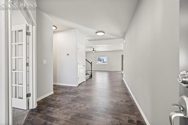 corridor featuring dark hardwood / wood-style floors