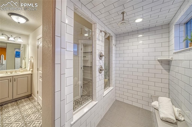 bathroom featuring vanity and a shower with door