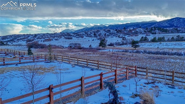 mountain view featuring a rural view