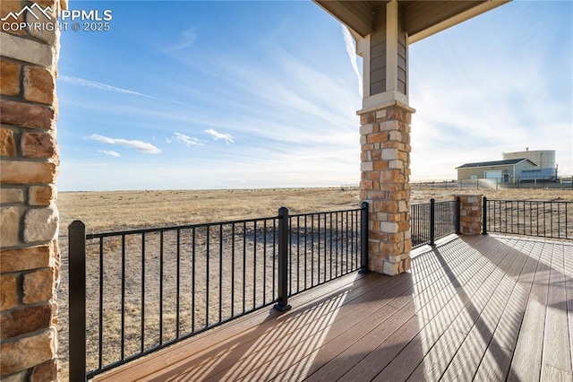 wooden terrace with a rural view