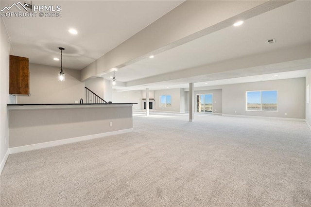 basement featuring light colored carpet