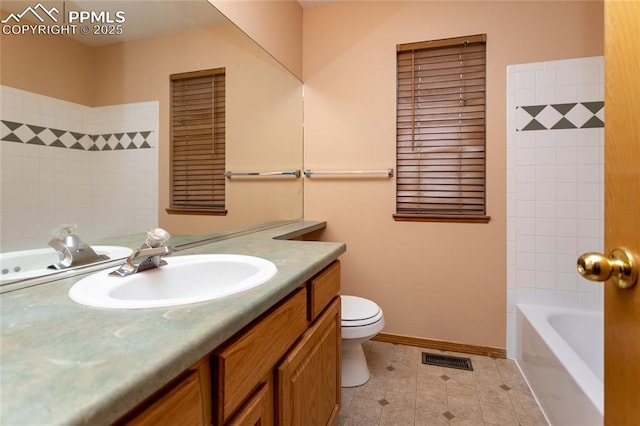 bathroom with toilet and vanity