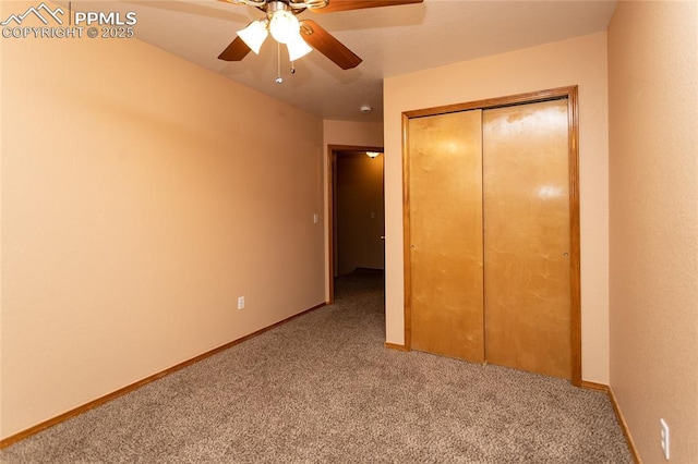 unfurnished bedroom featuring ceiling fan, a closet, and carpet floors