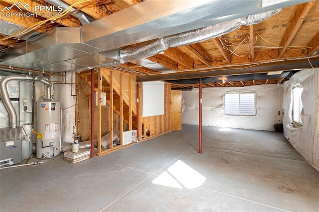 basement with heating unit and water heater