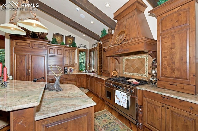 kitchen featuring light stone countertops, custom range hood, high end appliances, pendant lighting, and wood-type flooring