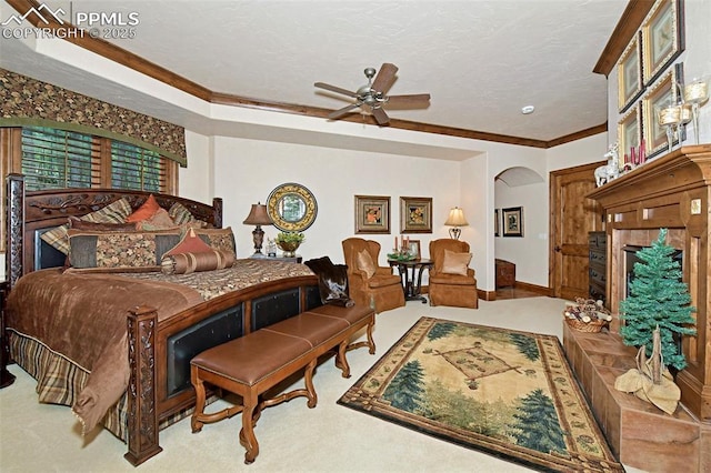 bedroom with light carpet, ceiling fan, and ornamental molding