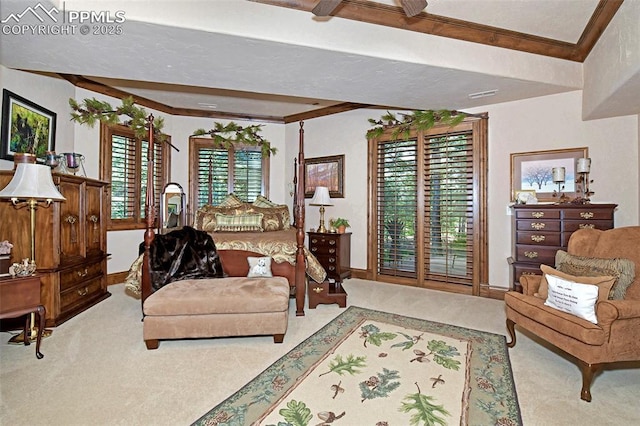 carpeted living room featuring a healthy amount of sunlight and beam ceiling