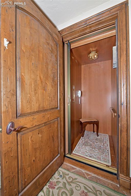 doorway featuring tile patterned flooring