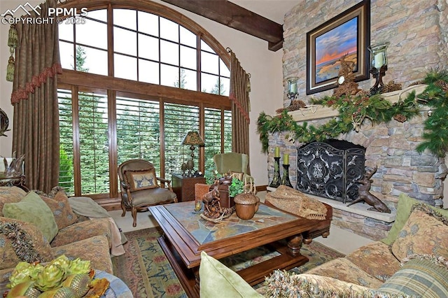 living room featuring a fireplace and beam ceiling