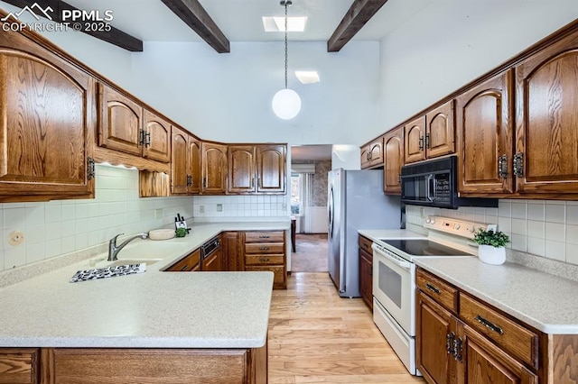 kitchen with electric stove, sink, hanging light fixtures, beamed ceiling, and light hardwood / wood-style floors