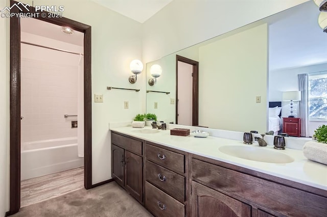 bathroom with shower / tub combination and vanity