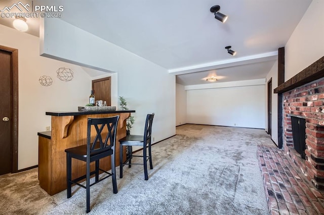 bar featuring carpet flooring and a brick fireplace