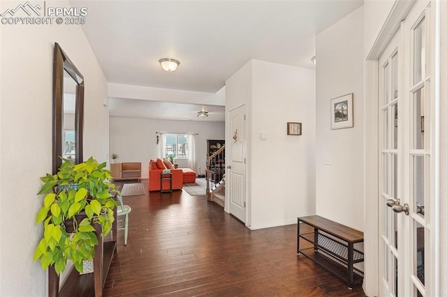 corridor featuring french doors and dark wood-type flooring