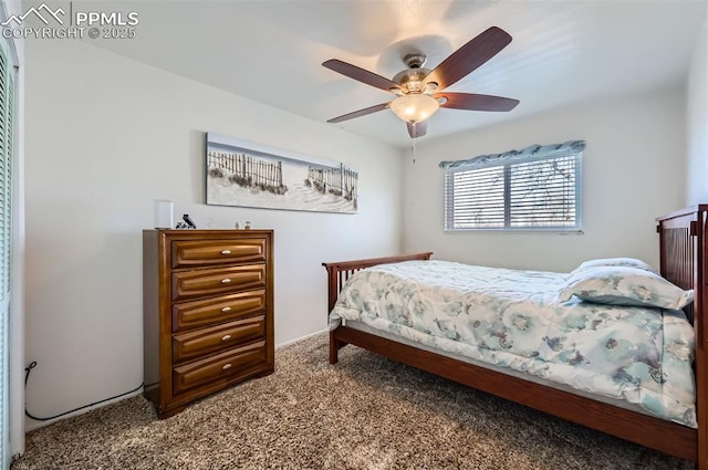 bedroom featuring ceiling fan and carpet