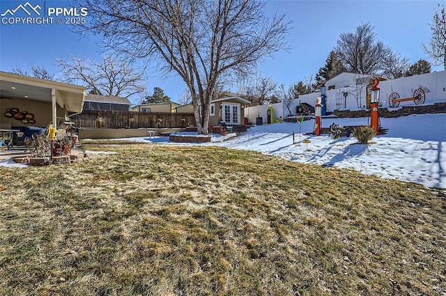 snowy yard with french doors