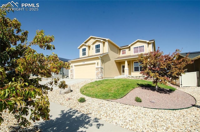 view of front of home with a garage and a front lawn