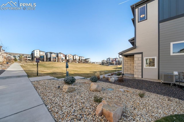 view of yard with central AC