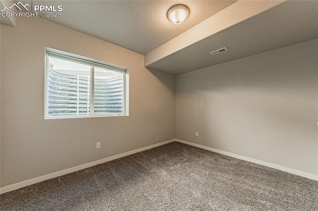 spare room featuring carpet flooring