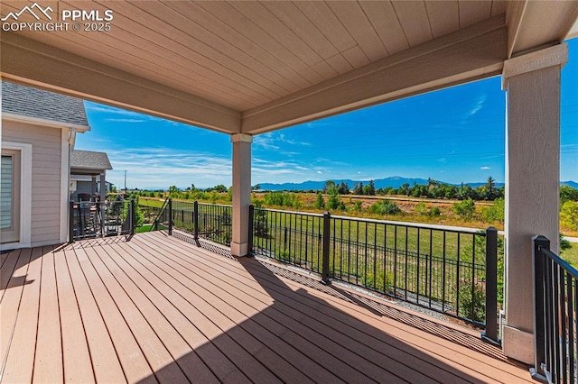 wooden deck featuring a mountain view