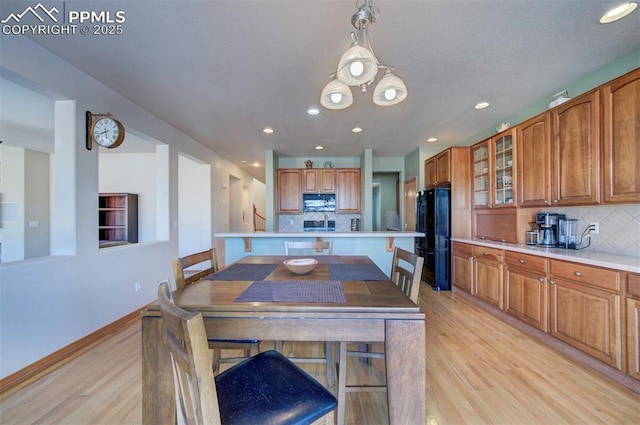 dining space featuring light hardwood / wood-style floors