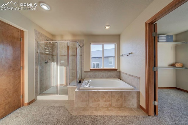 bathroom with tile patterned floors and separate shower and tub