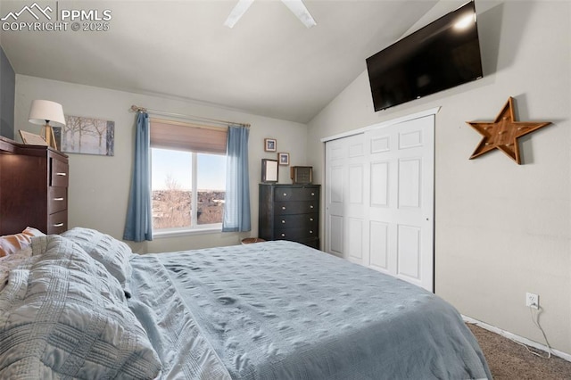 carpeted bedroom with a closet, vaulted ceiling, and ceiling fan