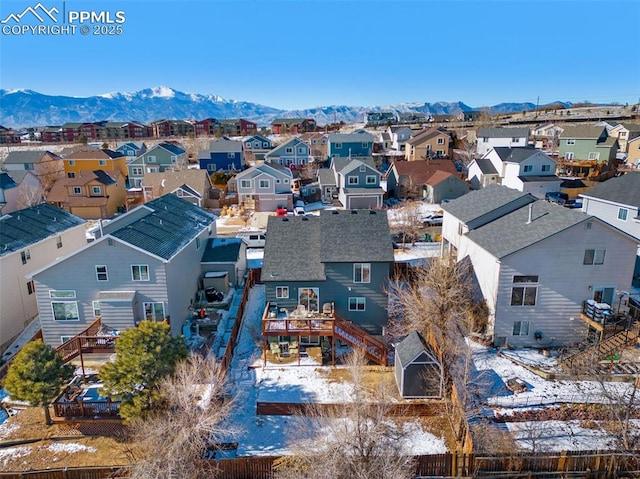 snowy aerial view featuring a mountain view