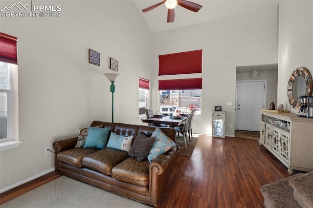 living room with hardwood / wood-style floors, ceiling fan, and high vaulted ceiling