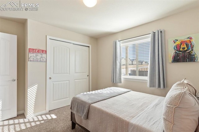 bedroom with light carpet and a closet