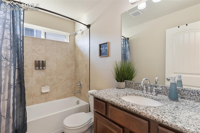 full bathroom featuring shower / tub combo with curtain, vanity, and toilet