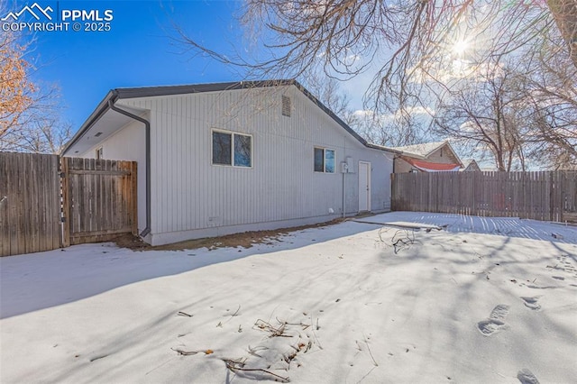 view of snow covered house