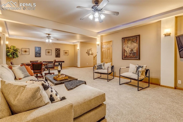 carpeted living room with ceiling fan