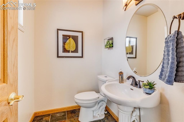 bathroom with toilet and sink