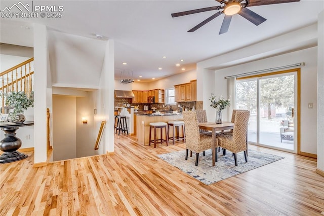 dining space featuring ceiling fan and light hardwood / wood-style flooring