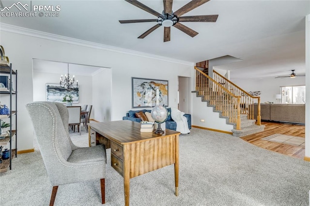 carpeted office space with ceiling fan with notable chandelier and crown molding