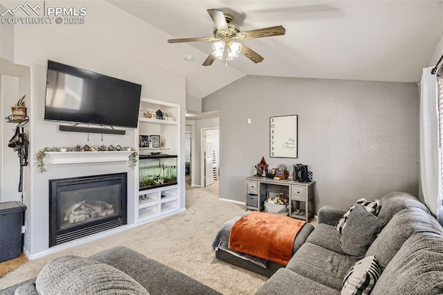 living room featuring built in features, carpet floors, vaulted ceiling, and ceiling fan